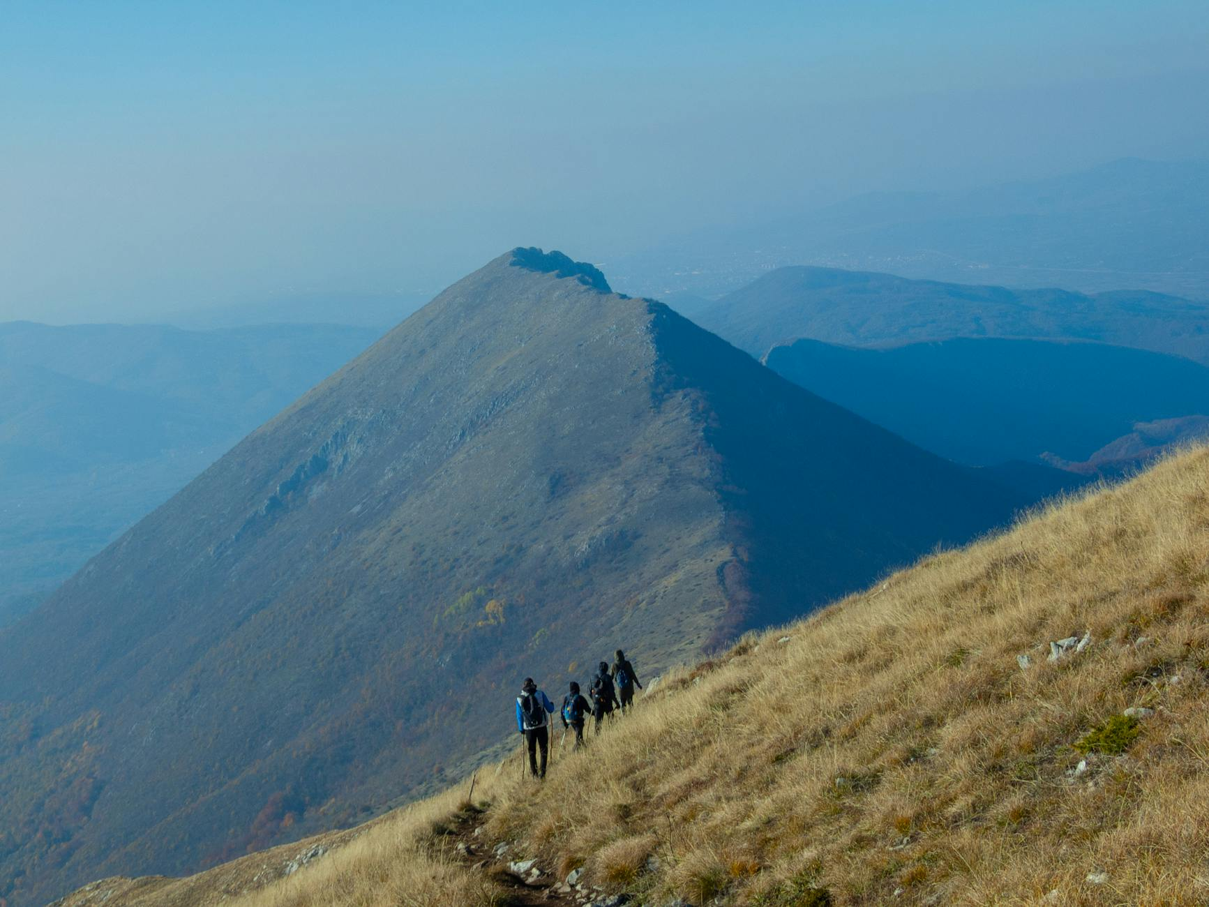 elderly group hiking mountains